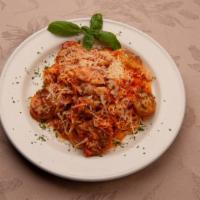 Crab & Scallops · Dungeness crab and pan-seared scallops in a tomato cream sauce, and over angel hair pasta.