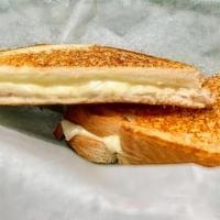 Kids Grilled Cheese · Small grilled cheese on white bread with white american cheese