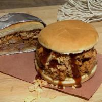 Sloppy Joe · Slow cooked beef and pork with tangy peppers and onions served on a toasted bun.