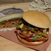 Spicy Italian · Spicy smoked sausage, sautéed peppers and onions on a toasted bun with QC's Que.