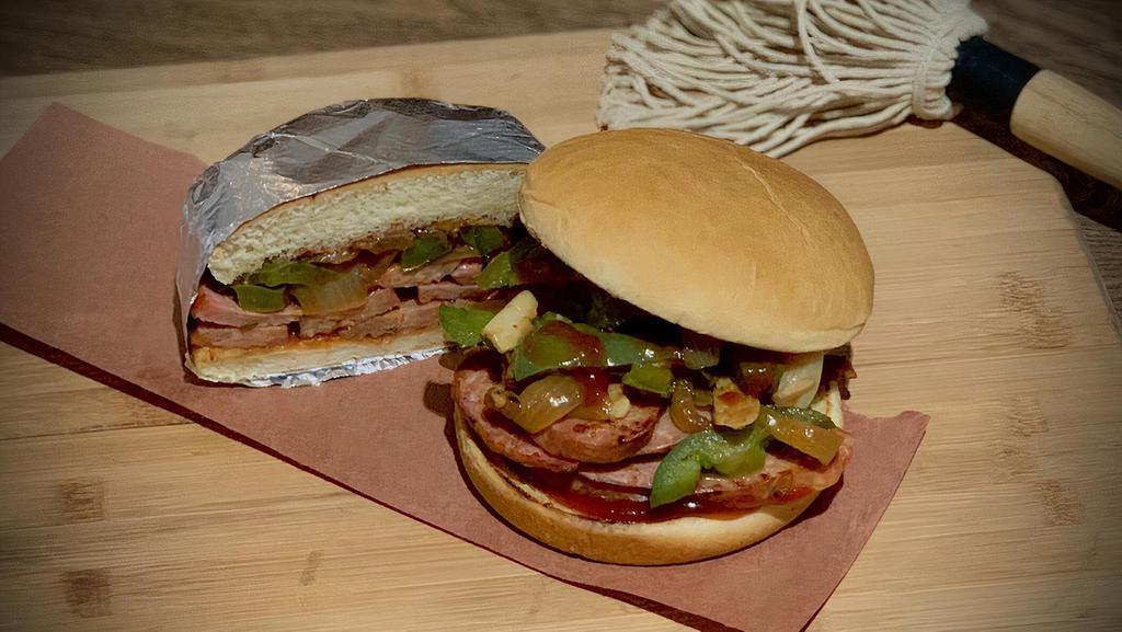 Spicy Italian · Spicy smoked sausage, sautéed peppers and onions on a toasted bun with QC's Que.