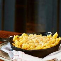 Mac N' Cheese · Vegetarian. Shell pasta tossed in a creamy four-cheese sauce topped with Parmesan and served...
