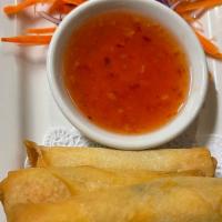 Egg Rolls · Deep-fried vegetables and glass noodles in rice paper with sweet and sour sauce.