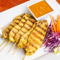 Chicken Satay · Grilled chicken breast marinated with curry powder and Thai herbs, served with peanut sauce.