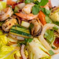 Seafood Salad · Grilled jumbo prawns, scallops, calamari, mussels, tomato, lemongrass, spring mix, cucumber,...