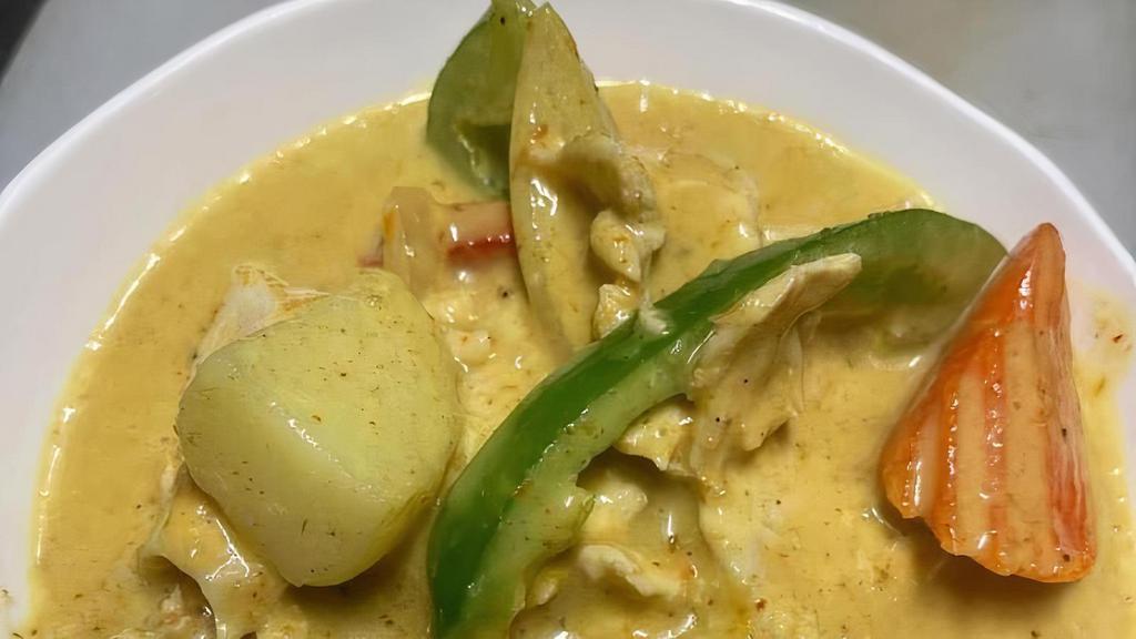 Yellow Curry · Potato, carrot, onion, bell pepper in coconut, and yellow curry.