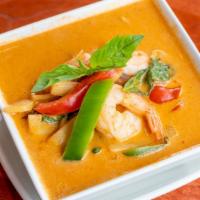 Red Curry · Eggplant, bamboo shoots, bell pepper, and basil leaves in red curry.