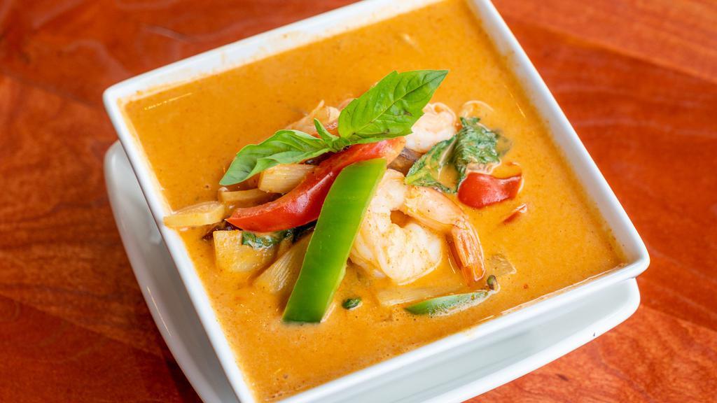Red Curry · Eggplant, bamboo shoots, bell pepper, and basil leaves in red curry.