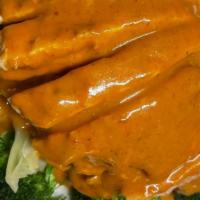 Lemongrass Chicken · Grilled chicken breast with lemongrass, served on a bed of steamed broccoli, spinach, carrot...