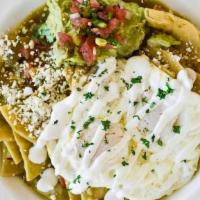 Chilaquiles · Salsa Verde, Queso Fresco, Guacamole, Sour Cream, Pico de Gallo, Two Egg Over Easy