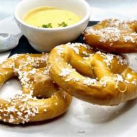 Pretzels · Three Bavarian pretzels, buttered and salted, served with Pimento Wood Lager Beer Cheese Sau...