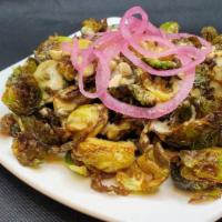 Brussels Sprouts · Flashed Fried, Garlic Miso Sauce, hazelnuts, Pickled onions. (Vegan)
