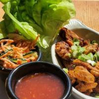 Lettuce Wraps · Spicy Gochujang marinated Grilled chicken with bibb lettuce, cucumber salad, sweet chili sau...