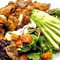 Crispy Chicken Salad · Crispy chicken, avocado, chopped hard boiled egg, bacon bits, diced tomato all on a bed of m...