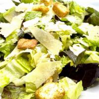 Caesar Salad · Crisp romaine, croutons, shaved parmesan, and house-made Caesar dressing.