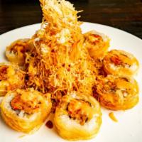 Tornado Roll · Lobster meat, shrimp tempura, spicy crab wrapped with thin potato, and deep-fried topped wit...
