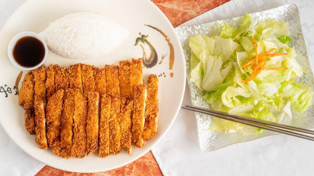 Chicken Katsu · Served with rice and salad.