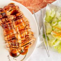 Spicy Garlic Chicken Teriyaki · Served with rice and salad.