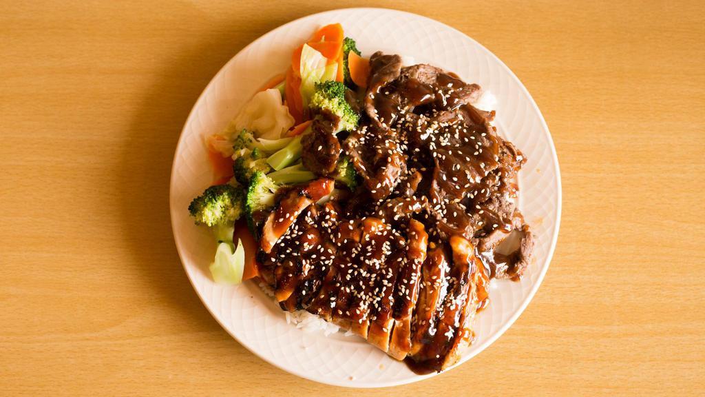Teriyaki Chicken & Beef Plate · Served with Steam rice, veggies (Broccoli, cabbage, and carrots),  Teriyaki Chicken, Teriyaki Beef, sesame seeds, and teriyaki sauce