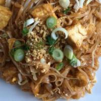 Phad Thai · Rice noodles with tamarind sauce, bean sprouts, egg, onions and topped with ground peanuts.