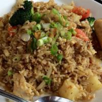 Pineapple Fried Rice · Stir fried rice with yellow curry powder, onions, cashew, tomato, egg and pineapple.