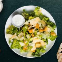 Casual Caesar Salad  · (Vegetarian) Romaine lettuce, house croutons, and parmesan cheese tossed with Caesar dressing.