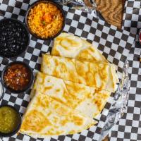 Quesadilla · Flour tortilla, filled with Cheddar Jack cheese and choice of marinated  meats. with red or ...