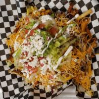 Carne Asada French Fries · carne asada french fries topped with lettuce, cheese, pico, sour cream