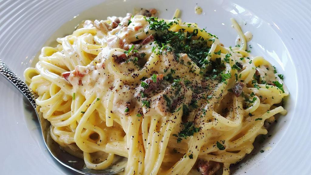 Spaghetti Carbonara · Creamy egg, pancetta, parmesan, crushed black
pepper