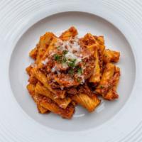 Rigatoni Alla Bolognese · Traditional Bolognese, soffrito, beef, basil and Parmesan cheese.