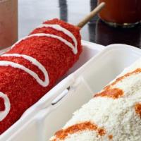 Elote Entero Hot Cheetos! · Whole Seasoned Mexican White Corn with Mayo, Salt, Lime, Fresh Cotija Cheese and then covere...