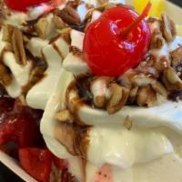 Banana Split · 3 Large scoops of Vanilla Bean Ice Cream with Pineapple Miel, Fresa Miel and Chocolate. Also...