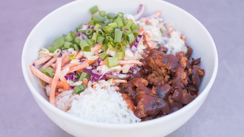 Mississippi · BBQ soy curls, two kinds of BBQ sauce, dill peppercorn ranch, fresh crisp slaw, and scallions on a bed of jasmine rice.