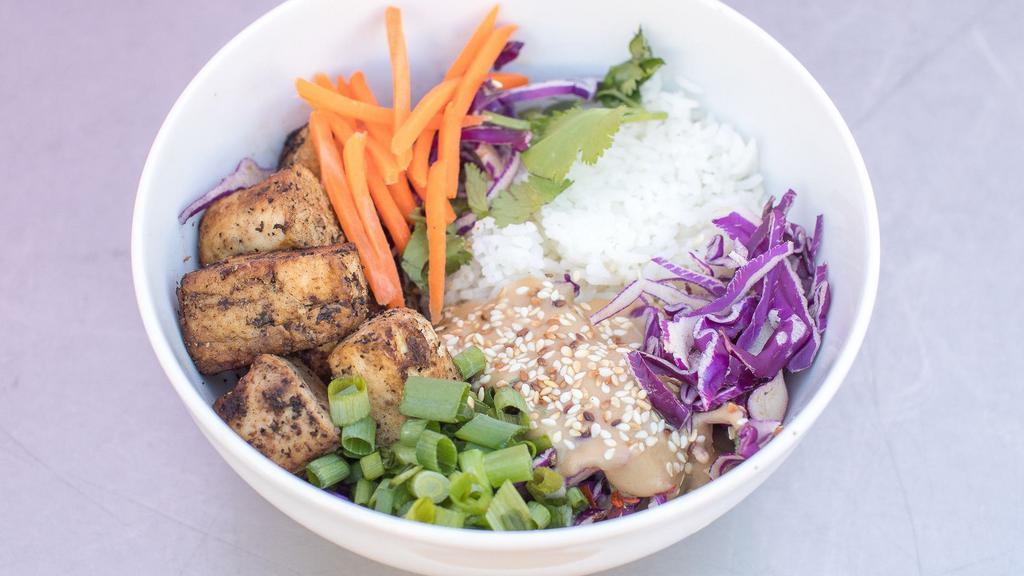 Broadway · Garlic tofu, peanut ginger sauce, cilantro, red cabbage, carrots, scallions, and toasted sesame seeds on a bed of jasmine rice.