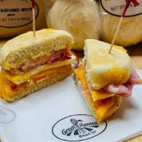 Egg Ham & Cheese · Made with freshly cracked eggs, cheddar cheese, ham,  
tomato, and onion on a whole wheat or...