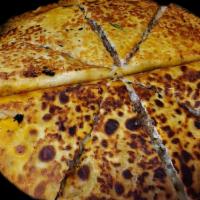 Pizzadillas Box · (2) 14in flour tortillas filled with shredded cheese, choice of meat, cilantro and onions fr...