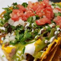 Mexican Nacho Supreme · Chips, shredded cheese, nacho cheese, choice of meat, cilantro, onions, tomatoes, jalapeños,...