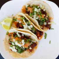 Tacos · Four street style tacos with choice of meat, side of rice and beans.