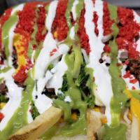 Hot Cheeto Burrito  · Mexican Huge Burrito with hot cheeto dust added and sliced avocados or avocado sauce