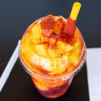 Mangonadas · Thick mango smoothie, with tajin, chamoy, lime topped with cubed mango and more chili powder...