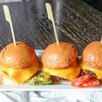 Slider Basket · 3 sliders burgers topped with grilled onions cheddar cheese, and burger sauce. Served with f...