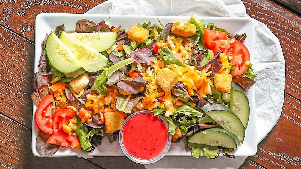 House Salad · Crisp lettuce mix served with cucumbers, tomatoes, carrots, celery, cheese & croutons. Italian, ranch or 1000island dressing