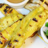 Chicken Satay · Skewers of BBQ chicken, marinated in a light curry served with peanut sauce, and cucumber sa...
