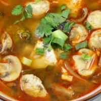 Tum Yum · Clear spicy soup w/ a touch of lemongrass, galanga root, kaffir leaves, tomatoes, onions, mu...