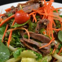 Beef Salad:* · Sliced grilled beef flavored w/ spicy lime sauce and tossed w/ lettuce, tomato, mint, onion,...