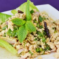 Larb:* · Ground chicken or tofu mixed with shallot, green onions, lemongrass, cilantro, and mint, tos...