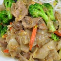 Pad See Ew · Pan-fried wide-size rice noodles with egg, broccoli, and carrots, flavored with sweet soy sa...