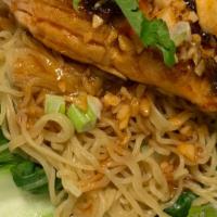 House Salmon Noodle · Sautéed Pacific Salmon with famous Pad Thai sauce and garlic, on a bed of steam Broccoli, Sp...