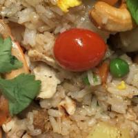 Pineapple Fried Rice · Fried rice with choice of protein, egg, pineapples chunks, raisins, cashew nuts, tomatoes, c...