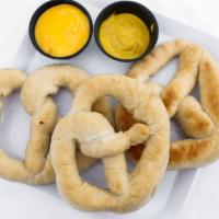 Pretzels And Beer Cheese · Soft, bavarian style pretzels served with beer cheese sauce.